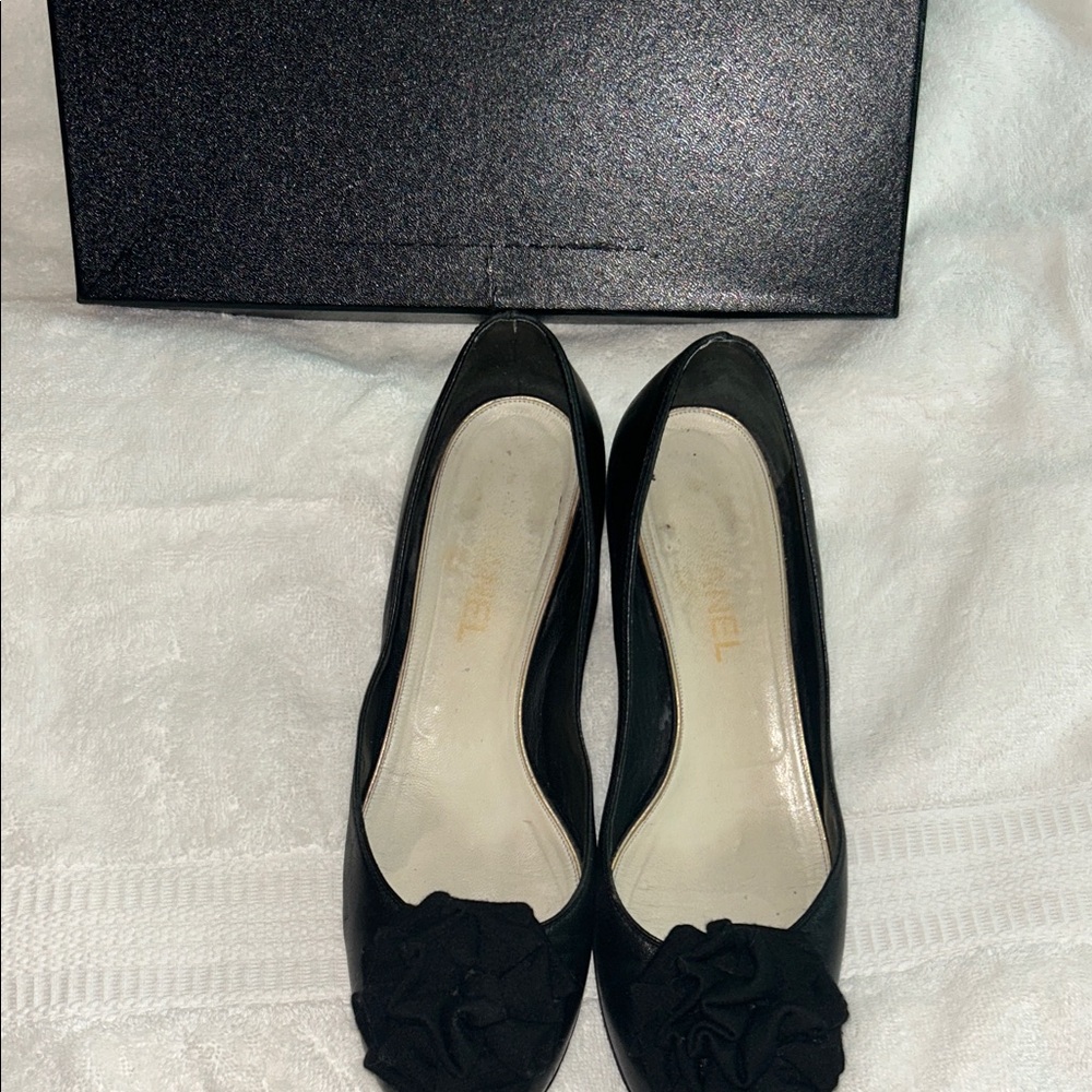 CHANEL Elegant Black Heels with Floral Accent